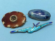 A Ruskin pottery brooch and two others