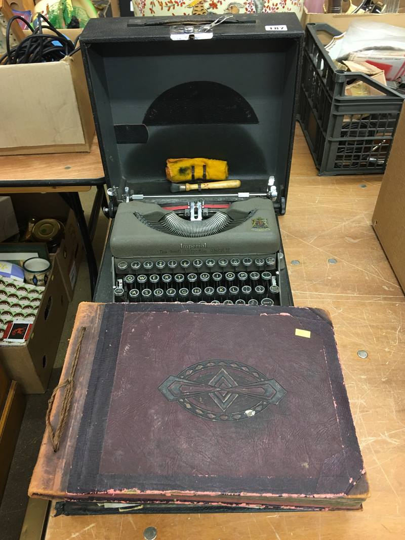 Photograph albums and a typewriter