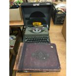 Photograph albums and a typewriter