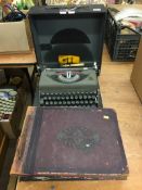 Photograph albums and a typewriter