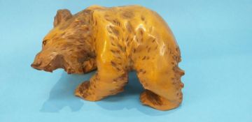 A large carved wooden bear, 30cm wide