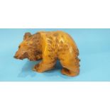 A large carved wooden bear, 30cm wide