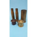 Three brass shells, a small cast iron inkwell and a brass tankard shaped string box (3)