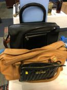 A Celine handbag, a Salvatore Ferragamo handbag and a Miu Miu purse