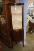 Mahogany bow front standing corner cabinet