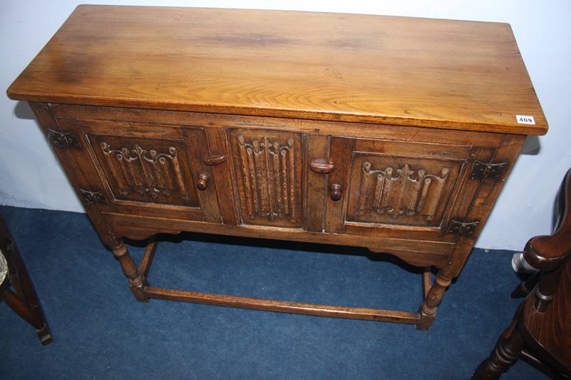 An oak linenfold side cabinet, 106cm wide