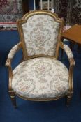 A French style gilt wood open armchair
