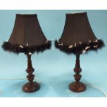 A pair of carved wood table lamps