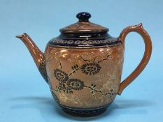 A Doulton Lambeth stoneware tea pot, with incised and painted decoration