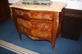 A Louis XV style marble top and serpentine fronted three drawer chest of drawers, with marquetry