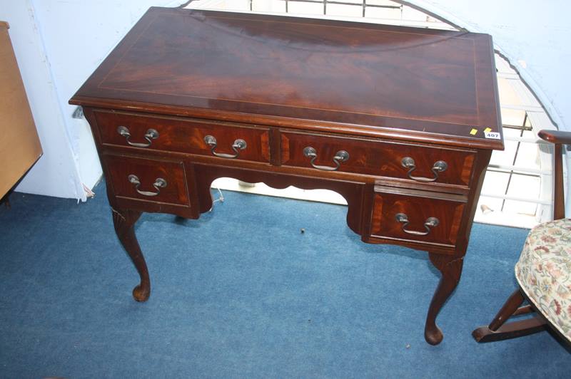 A reproduction mahogany lowboy, 98cm wide