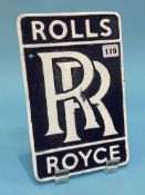 A cast Rolls Royce sign