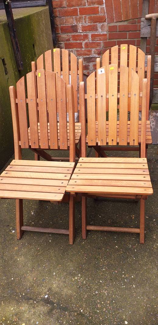 Four teak folding chairs