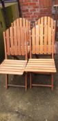 Four teak folding chairs