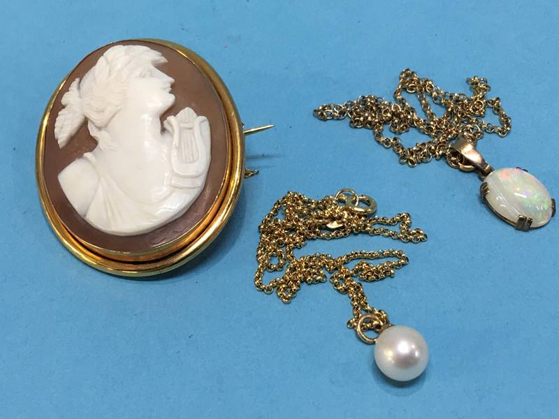 An opal pendant, a cameo brooch in '9ct' mount and a pearl necklace on 9ct gold chain
