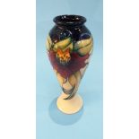 A modern Moorcroft tall vase, decorated with Irises, of baluster and tapering form, 27cm height