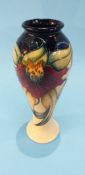 A modern Moorcroft tall vase, decorated with Irises, of baluster and tapering form, 27cm height