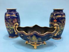 A pair of Carlton Ware 'Chinese' design vases, numbered 226, 26cm height and a matching flower bowl