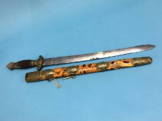 A Chinese short sword with tortoiseshell scabbard, engraved brass mounts and wood grip, length of