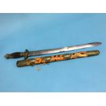 A Chinese short sword with tortoiseshell scabbard, engraved brass mounts and wood grip, length of