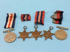 A group of five un-named World War II medals including Italy, France and Germany stars
