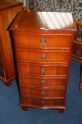 Pair of narrow yew wood serpentine fronted chest of drawers, 50cm wide