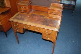 An Edwardian mahogany Ladies writing desk with inset leather top