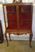 A walnut Queen Anne style china cabinet, supported on slender cabriole legs, 86cm wide