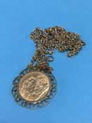 A full sovereign dated 1911, in 9ct mount on a chain stamped 9ct, total weight 23.2g