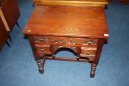 An Old Charm oak side table, with pull out top revealing a secret drawer, below one long and two