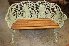 An apple green ornate two seater garden bench, 118cm wide