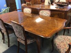 A Burr walnut eight piece dining room suite, comprising table four and two chairs and serpentine