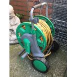 A rolling hose reel