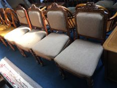 Set of four carved oak dining chairs