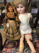 Bisque headed doll and one other
