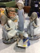 Three Lladro figures and one other