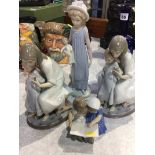 Three Lladro figures and one other