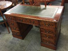 A Marshbeck Ltd reproduction yew pedestal desk with green leather inset