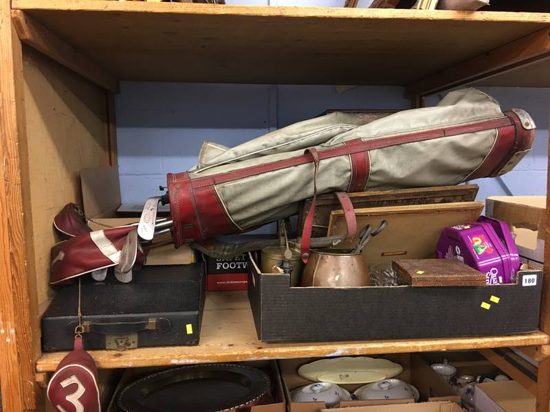 Shelf of assorted, golf clubs, typewriter, metal ware etc.