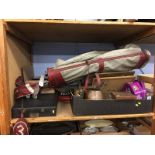 Shelf of assorted, golf clubs, typewriter, metal ware etc.