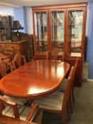 A yew eight piece reproduction dining room suite