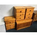 Three pine bedside cabinets and a blanket box