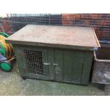 A rabbit hutch and a dog cage
