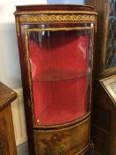 A Louis XV style bow front glass standing corner cabinet