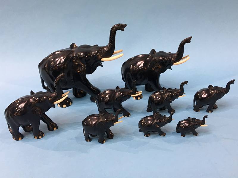 A set of nine graduating carved elephants