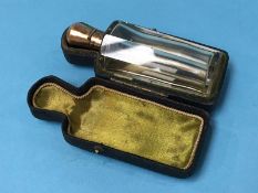 A small clear glass scent bottle, in original case