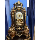 An impressive modern bracket clock with ornate case, decorated with gold coloured horses,