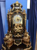 An impressive modern bracket clock with ornate case, decorated with gold coloured horses,