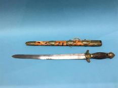 A Chinese short sword with tortoiseshell scabbard, engraved brass mounts, wood grip, length of blade