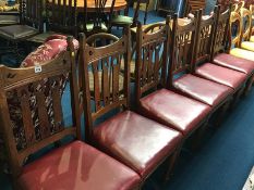 A set of six oak Arts and Crafts dining chairs